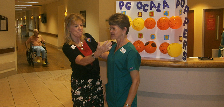 staff member talking to nurse