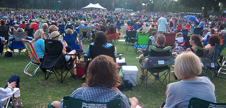 large outdoor gathering for symphony under the stars