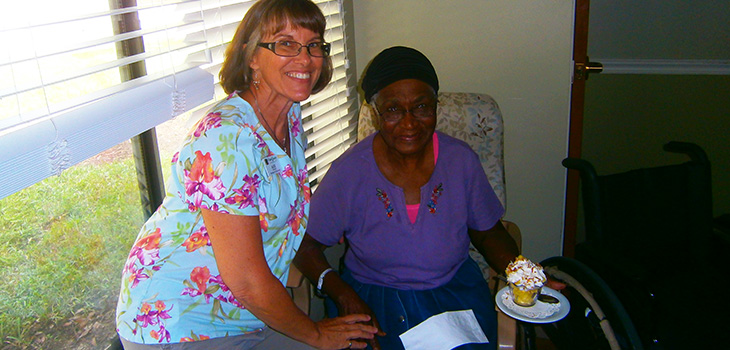 smiling nurse with resident